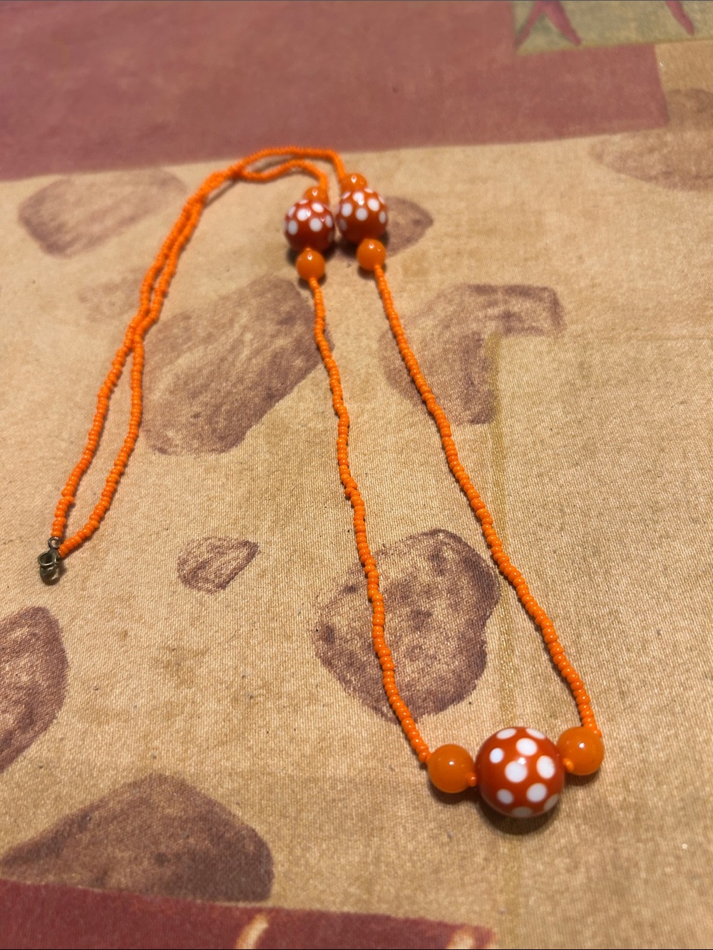 Orange Beaded Necklace with White Polka Dot Accent